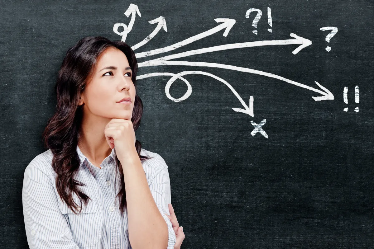 Women thinking with chalk arrows and symbols extending from her head, decision-making